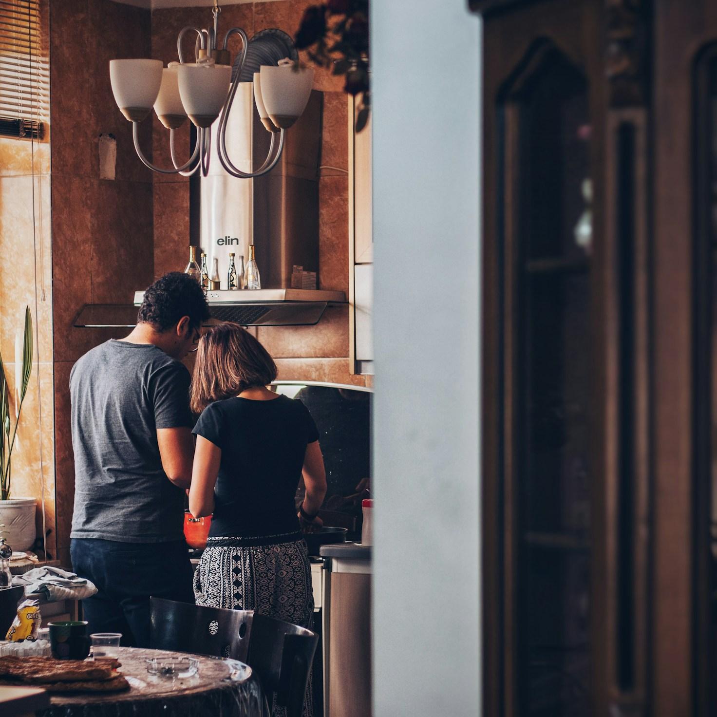 Diverse group of community members sharing a meal together, highlighting the connections built through collaborative cooking